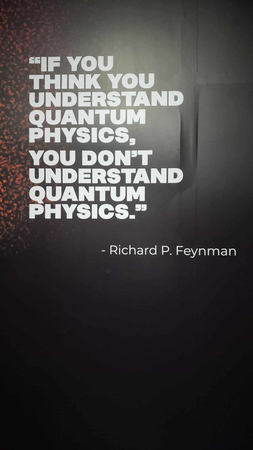 Photo of white text on a black background. It reads "If you think you understand quantum physics, you don't understand quantum physics." Richard P. Feynman